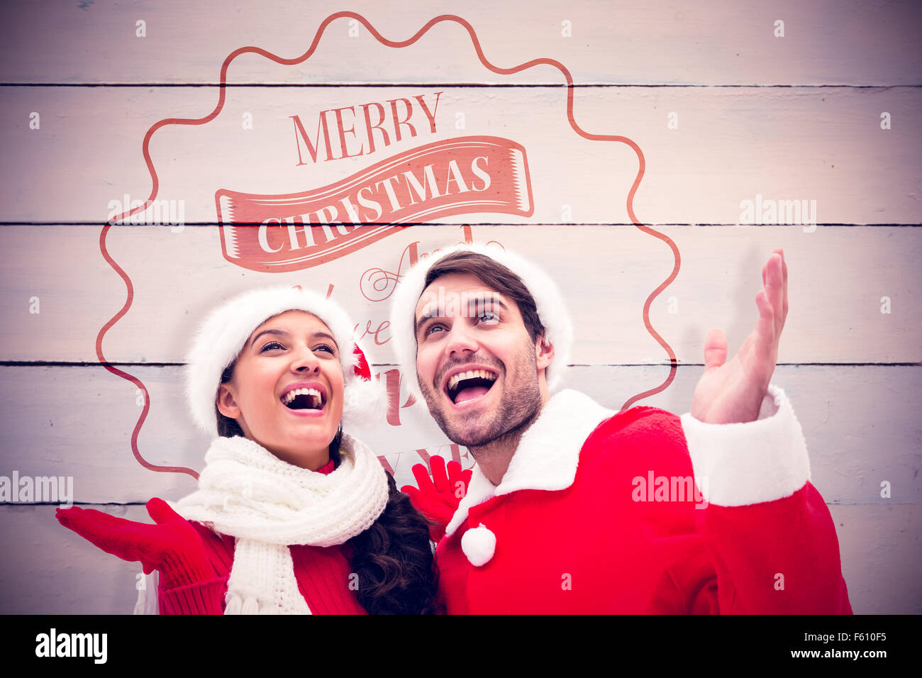 Composite image of festive young couple Stock Photo