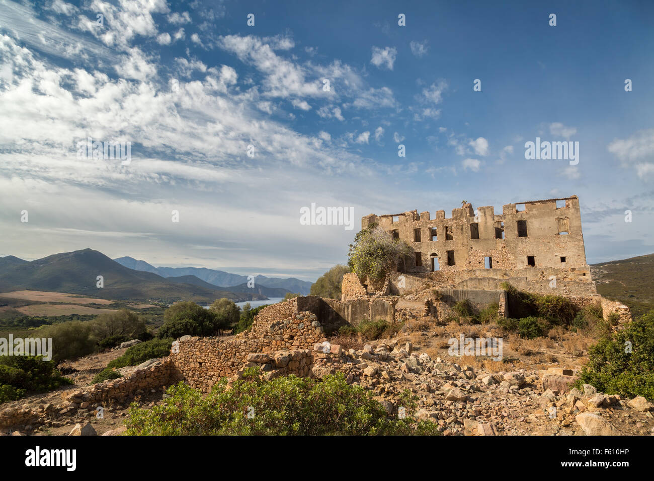 Derelict chateau of Pierre-Napoleon Bonaparte at Torre Mozza between Calvi and Galeria with mountains, coastline and blue skies Stock Photo