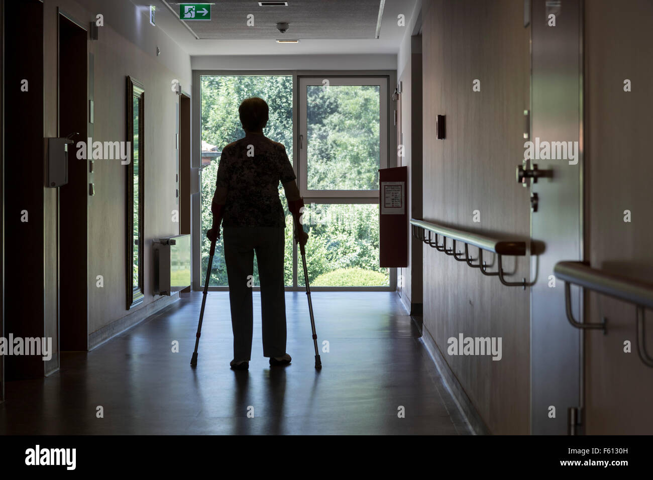 Elderly woman walking with crutches, hospital, rehab, Germany Stock Photo