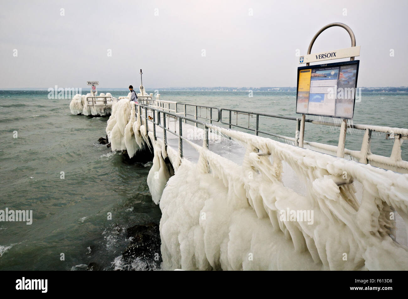 Ice-covered pier with a dummy during the February 2012 European cold wave in Versoix, Lake Geneva, Canton of Geneva, Switzerland Stock Photo