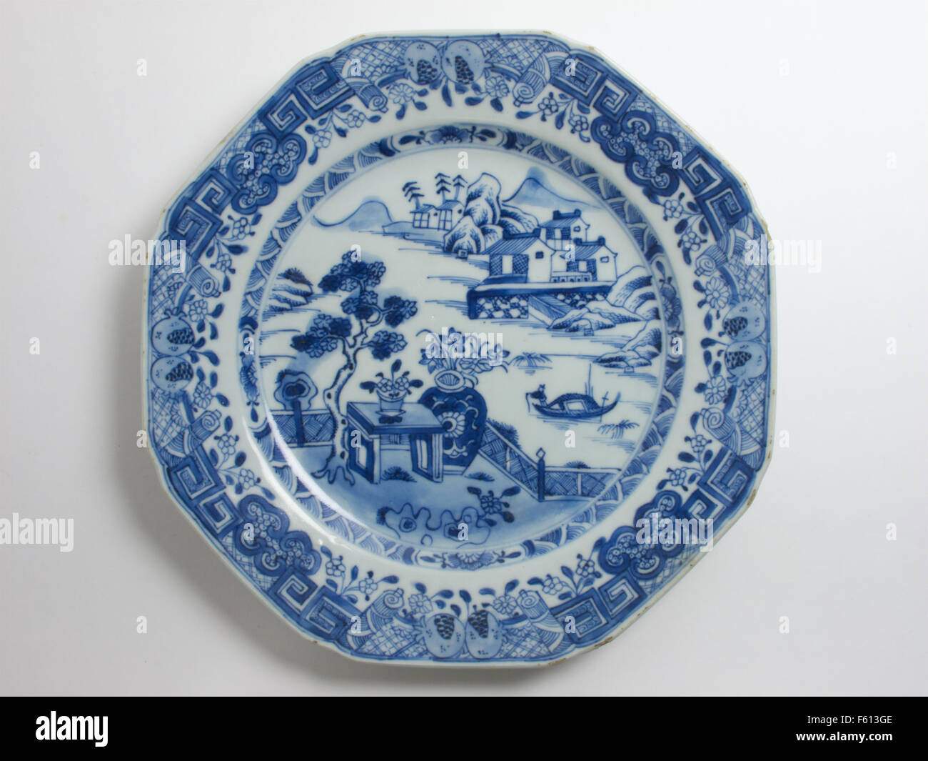 Antique 18th century Chinese blue and white porcelain plate painted with a pagoda landscape. The plate measures 16.5cm dia Stock Photo