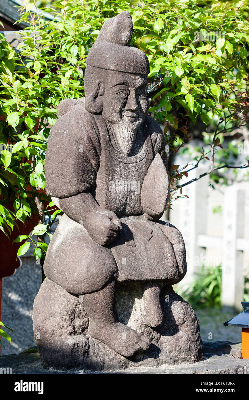 Statue of the Japanese God, Ebisu, aka Webisu, Hiruko god of fishermen and luck. One of the seven gods of good fortune, shichifukujin.. Stock Photo