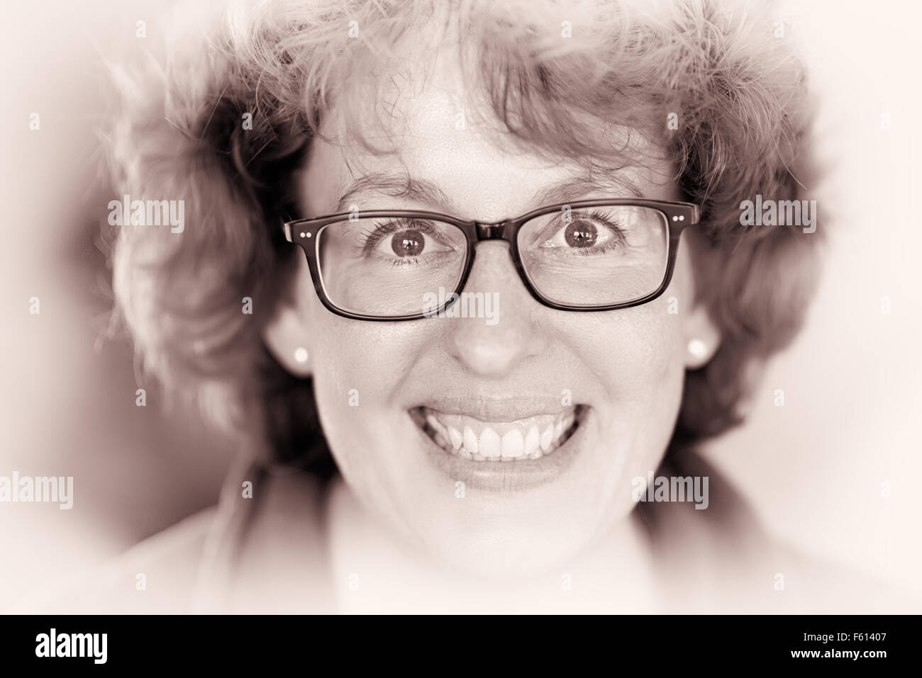 Closeup image of a laughing happy woman with glasses Stock Photo