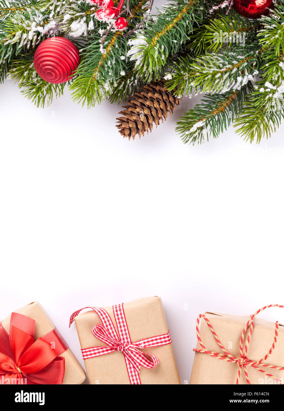 Christmas tree branch and gift boxes. Isolated on white background ...
