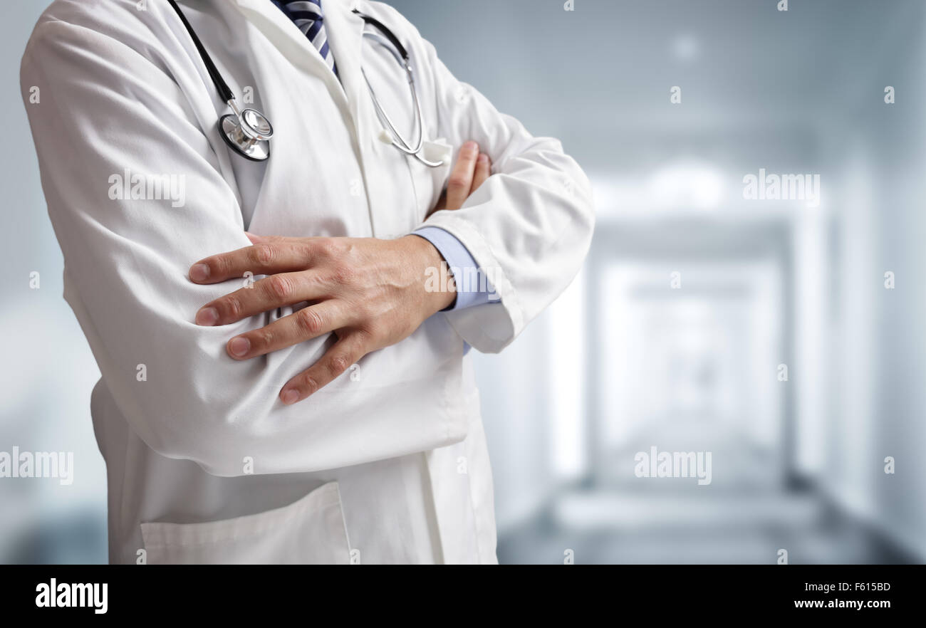 Doctor with stethoscope on duty in hospital ward corridor Stock Photo