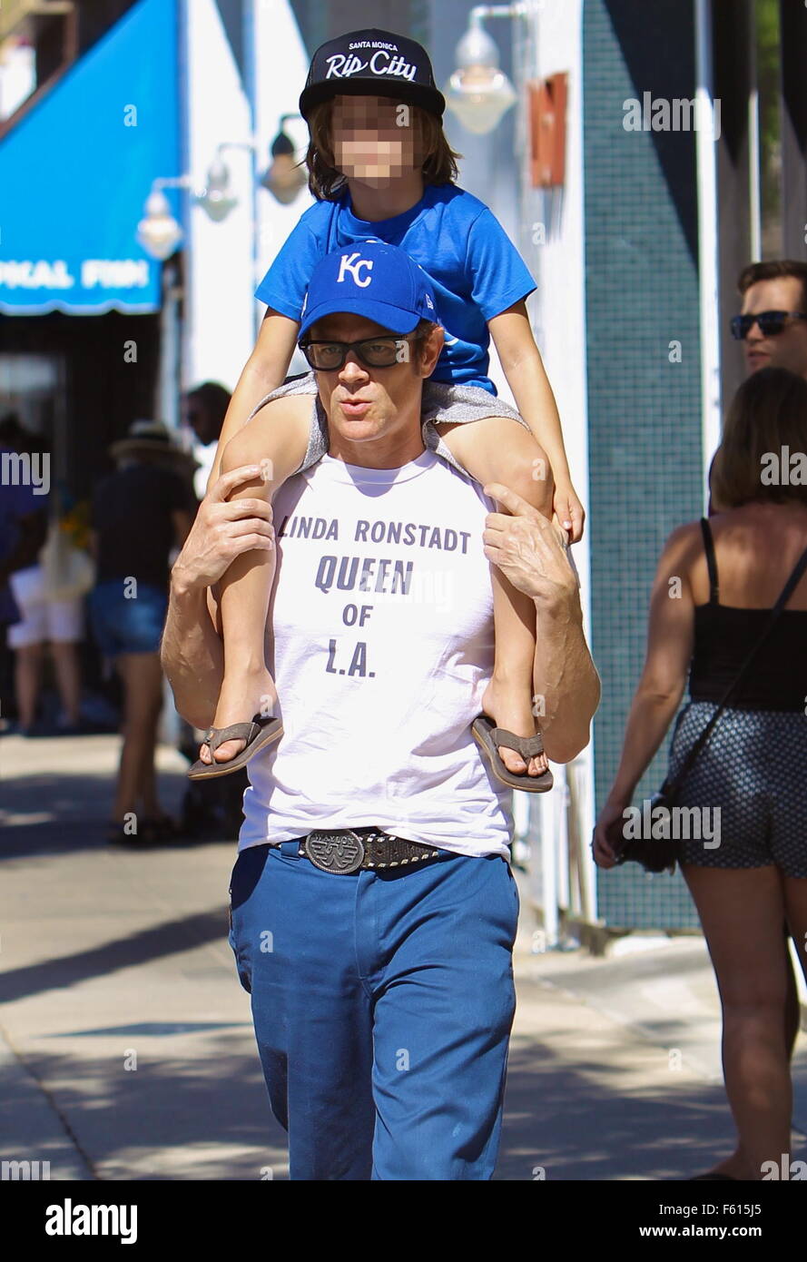 Johnny Knoxville gives his son Rocko a ride on his shoulders during a ...