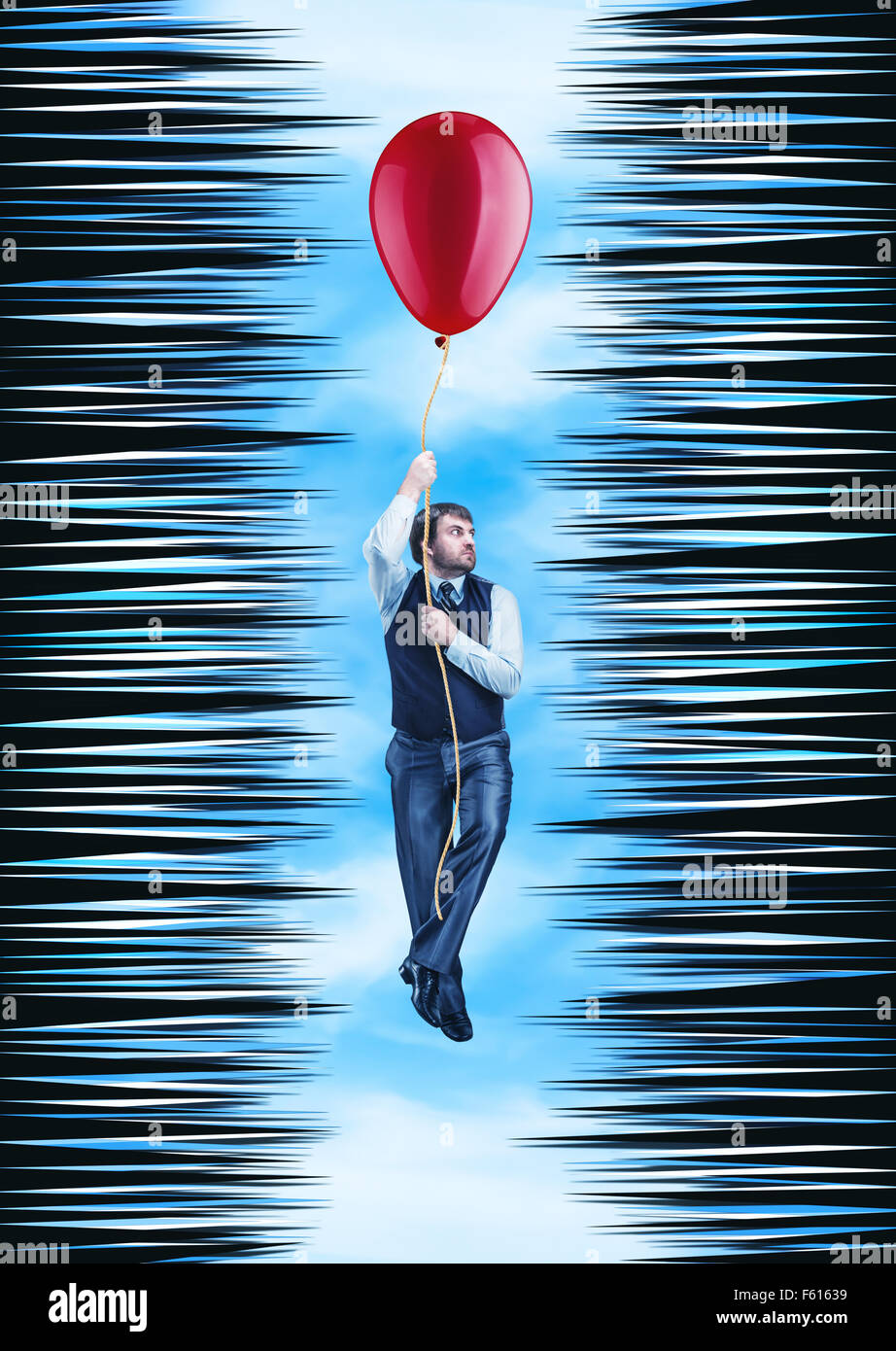 Businessman hanging on the rope with a big ballon in a thorny tunnel against sky Stock Photo
