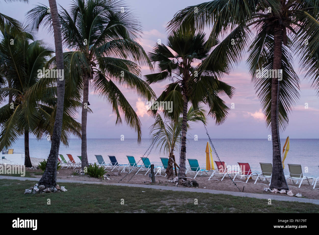 A beautiful sunset showing the beach and beach chairs at a resort in St. Croix, U.S. Virgin Islands. USVI, U.S.V.I. Stock Photo