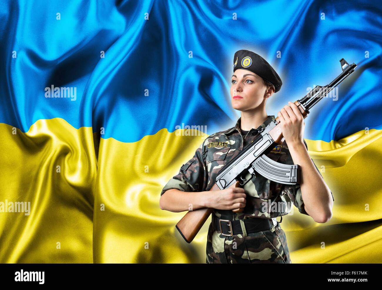Army Girl In Military Uniform On The Ukraininan Flag Background Stock army-girl-in-military-uniform-on-the-ukraininan-flag-background-stock