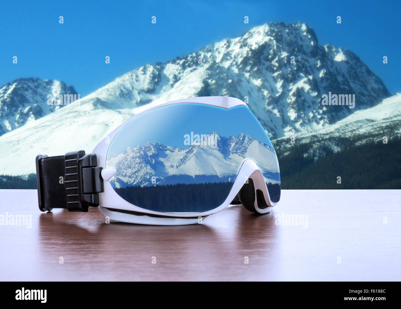White ski glasses against winter mountains Stock Photo Alamy