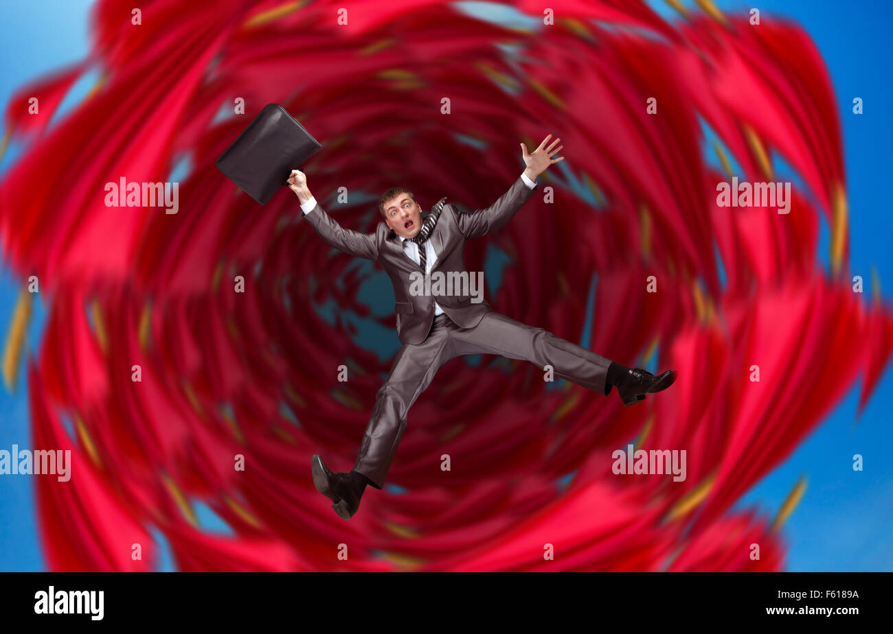 Businessman falls into abyss over red Stock Photo