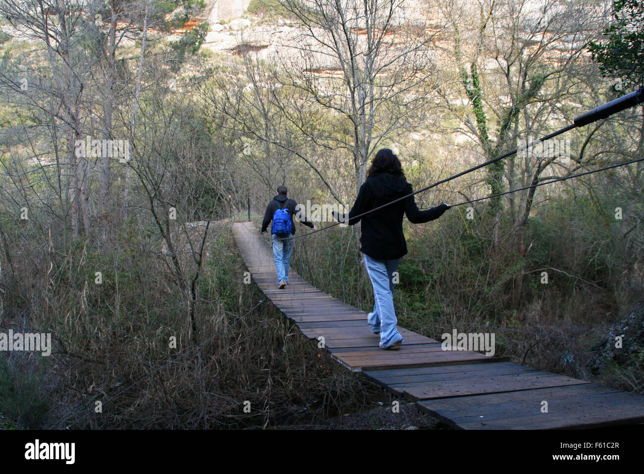 Man walking suspension bridge hi-res stock photography and images - Alamy