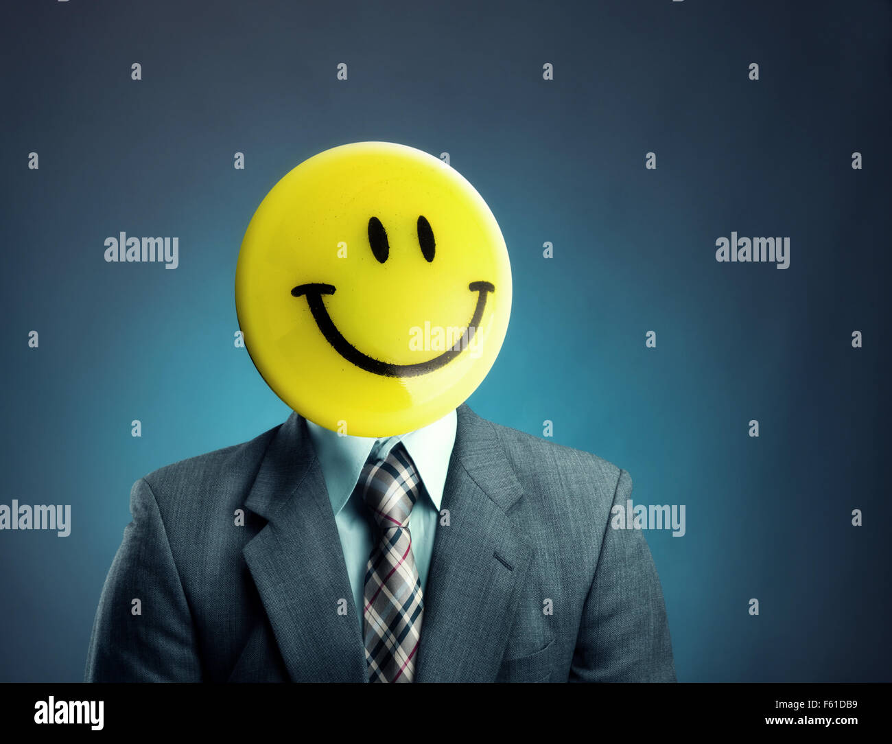 Businessman with smiley face instead of his head Stock Photo