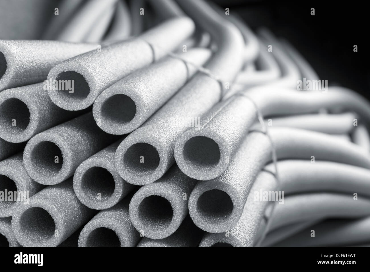Insulation for pipes on black Stock Photo Alamy