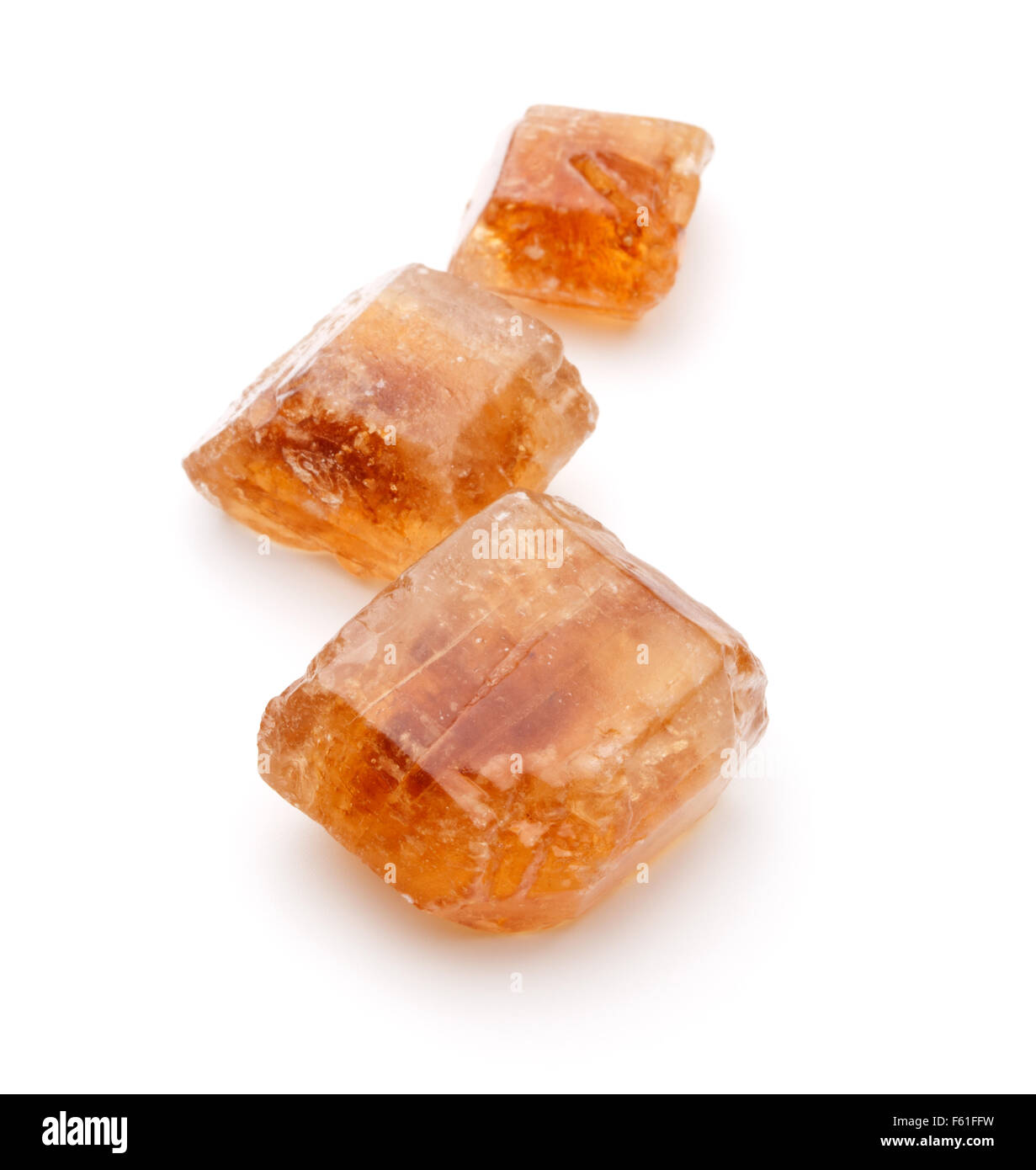 Brown caramelized lump cane sugar cube isolated on white background