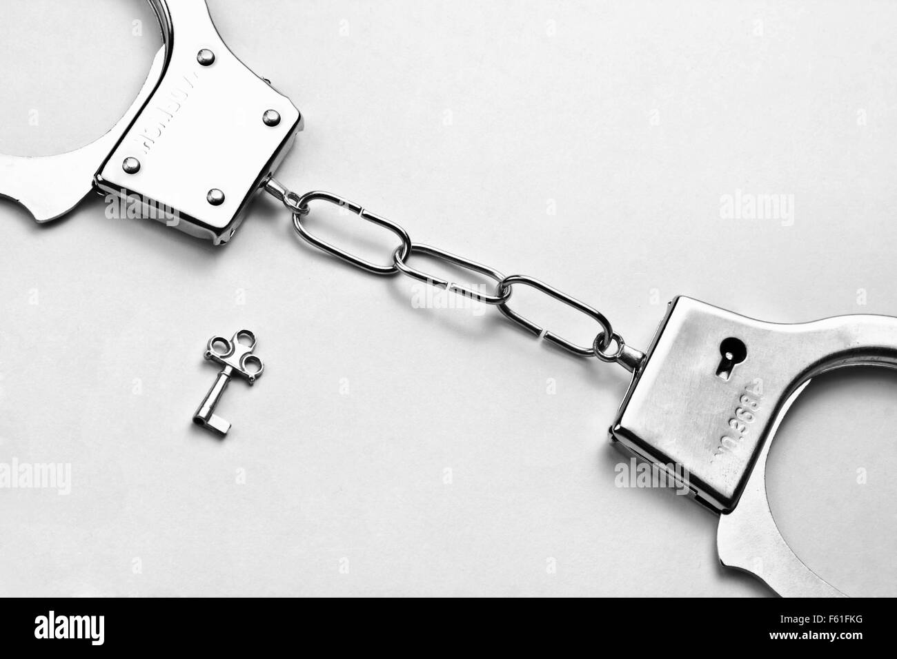 Handcuffs with key Stock Photo Alamy