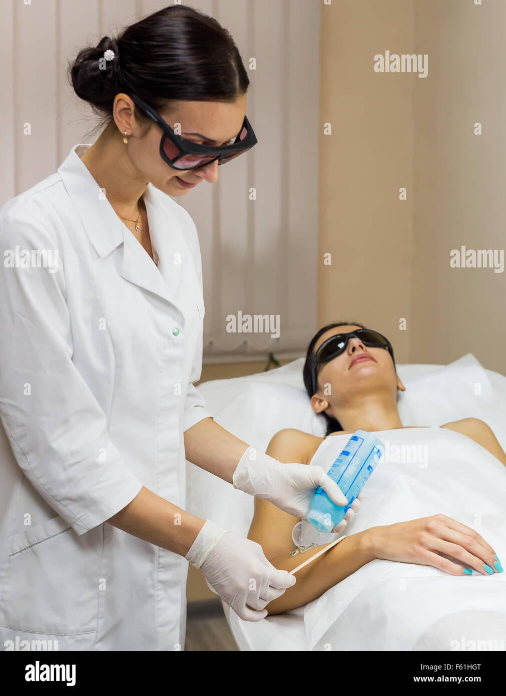 Beautician preparation epilation laser treatment Stock Photo
