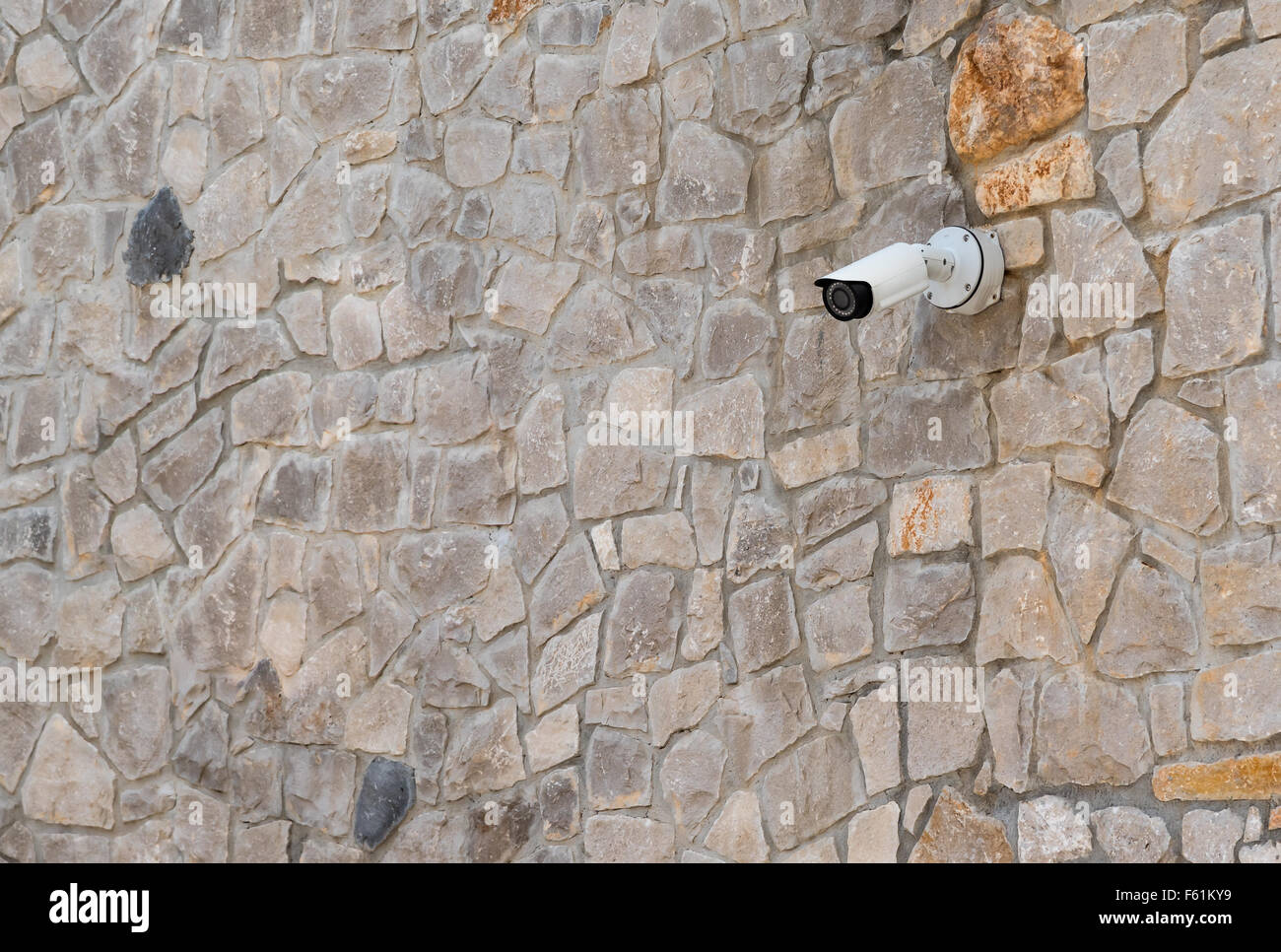 security camera on a stone wall Stock Photo