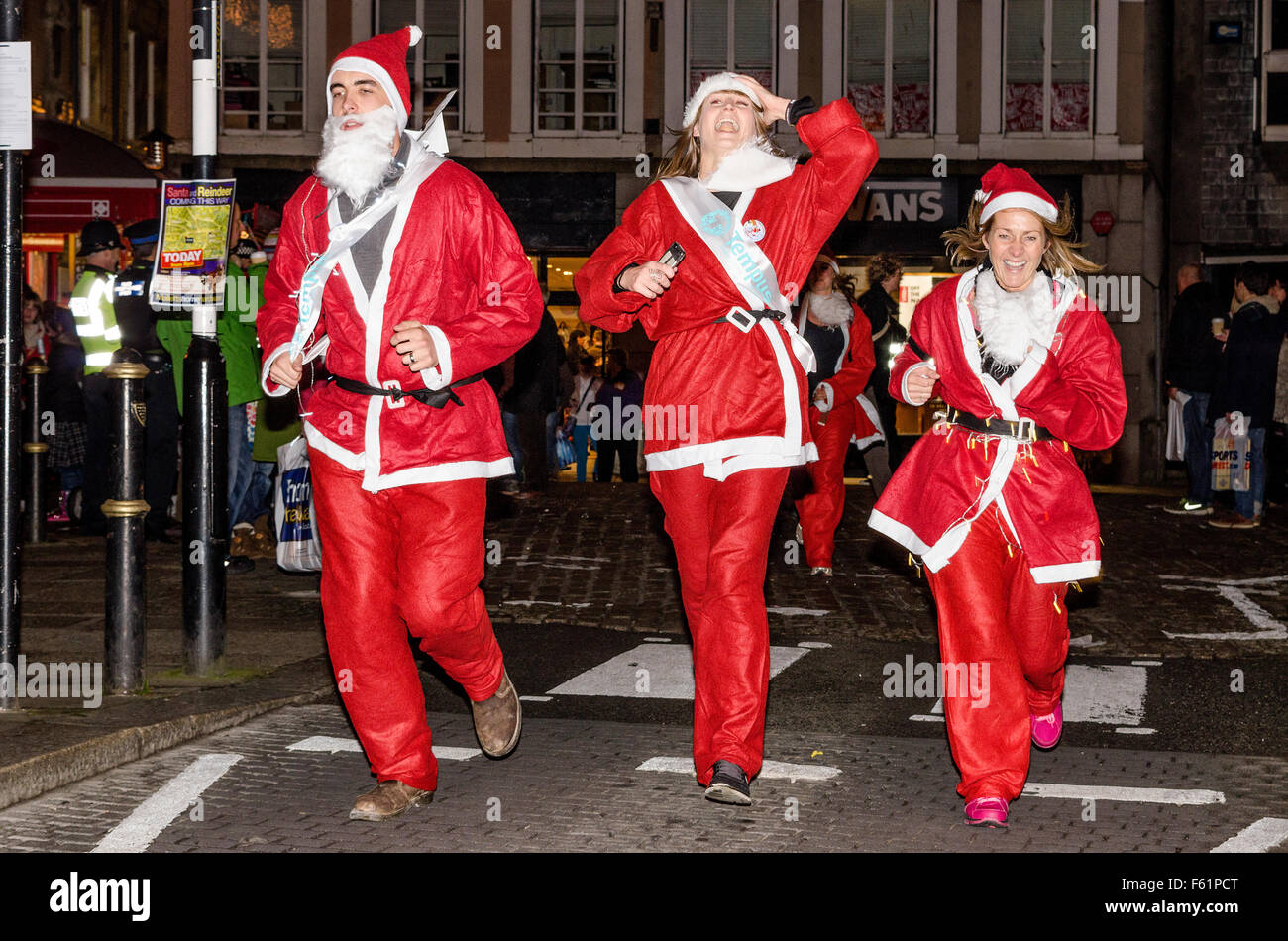 A charity santa fun run in truro, cornwall, uk Stock Photo