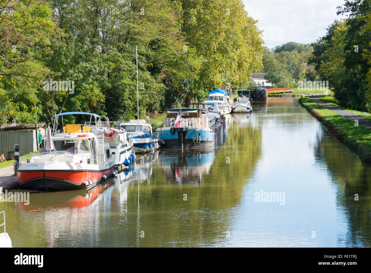 Boats moored on Le canal du centre, or central canal at Chagny France Stock Photo