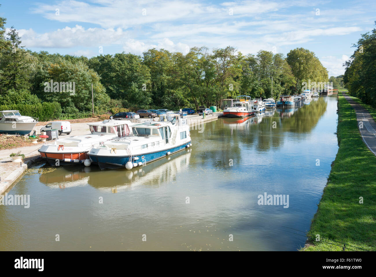 Boats moored on Le canal du centre, or central canal at Chagny France Stock Photo