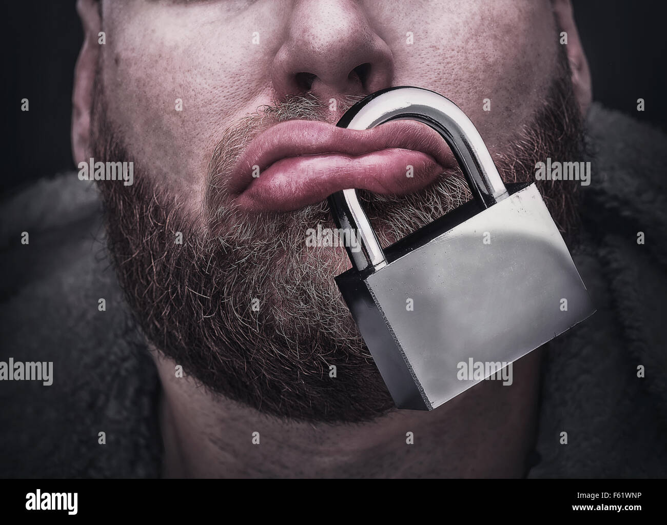 Closeup of male lips with a lock Stock Photo Alamy