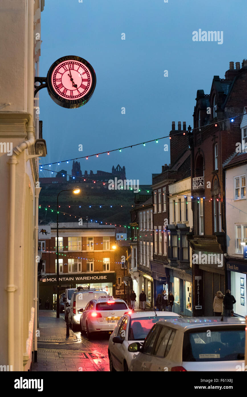 Evening in the resort and fishing port of Whitby, North Yorkshire, UK, with a view of the Abbey on the hill Stock Photo