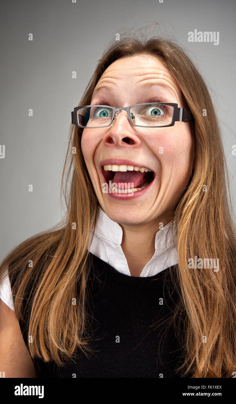 Portrait of stressed insane laughing business woman Stock Photo