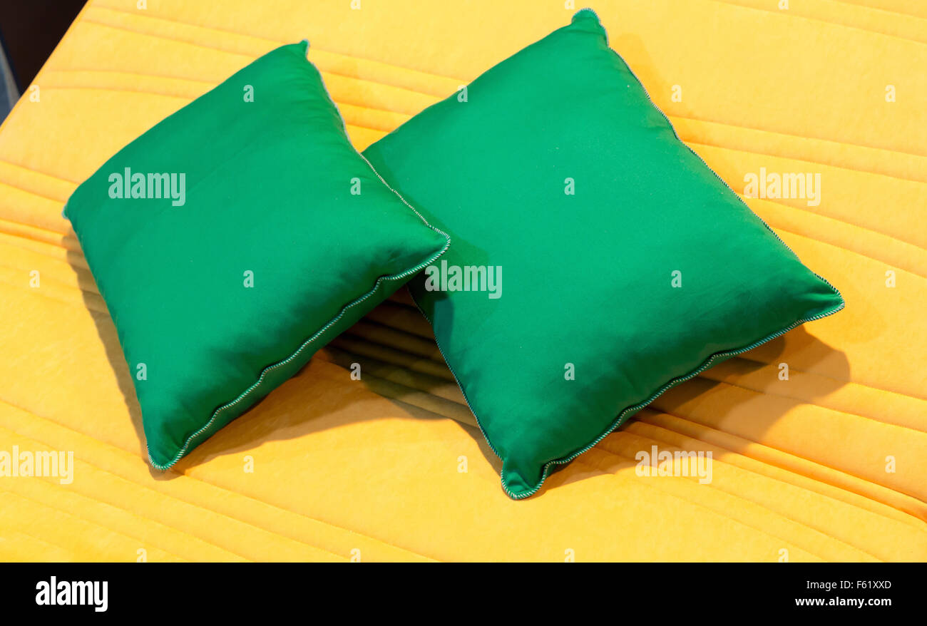 Colorful green pillows on hotel bed Stock Photo Alamy