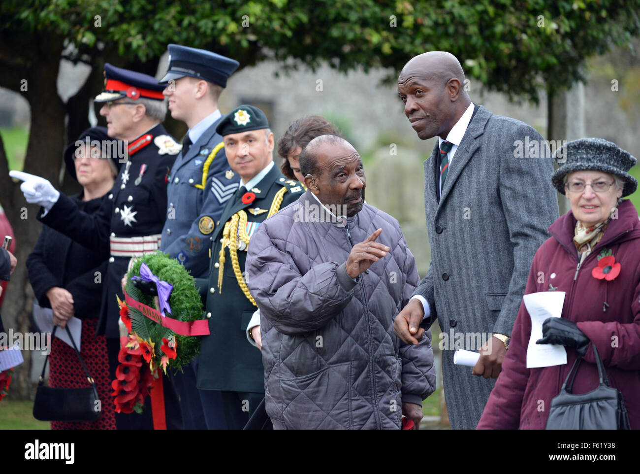 Seaford, UK. 10th Nov, 2015. Service and blue plaque unveling to commemorate the soldiers of the British West Indies Regiment, founded 100 years ago, that fought in the Great War. Family of the 19 soldiers that died in and were buried in Seaford Cemetery visited the graves and laid wreaths of black poppies.A Libation ceremony was carried out by professor Gus John, and a poem was read by poet Nairobi Thompson, before the blue plaque was unveiled. Peter Cripps/Alamy Live News Stock Photo