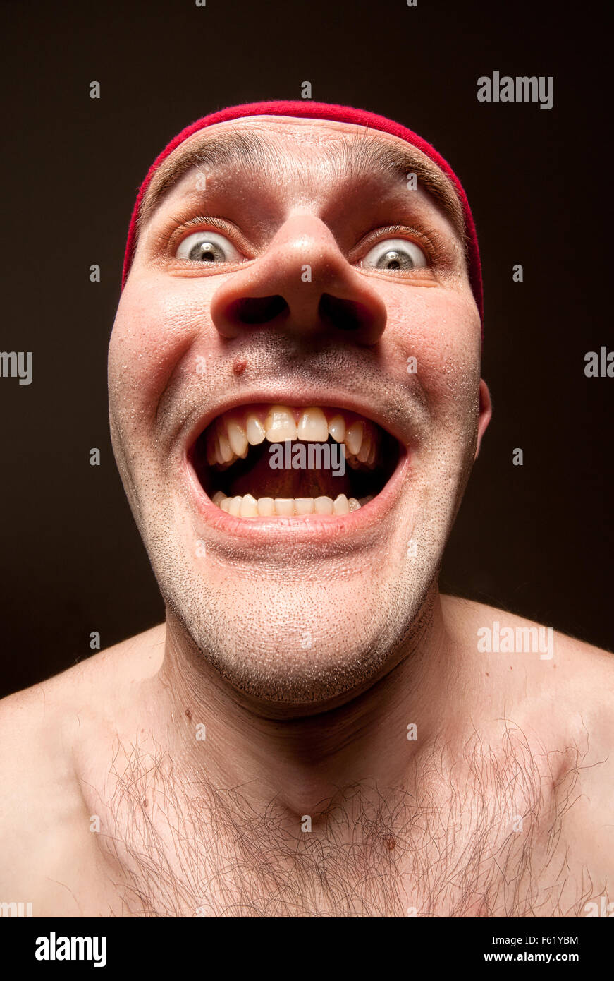 Close-up portrait of insane funny surprised man Stock Photo