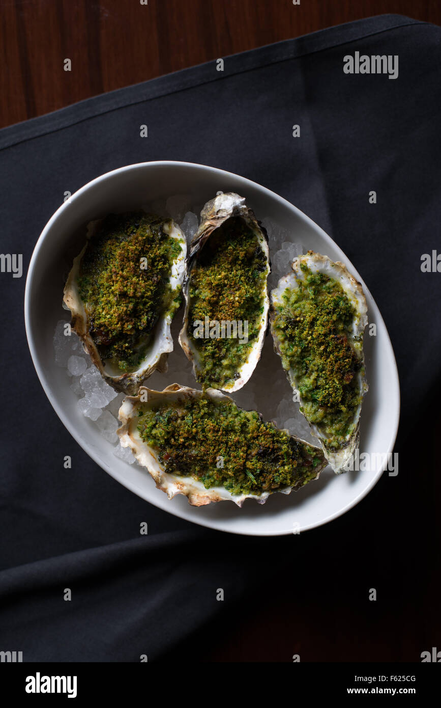 Overhead view of halfshell oysters made in the traditional rockefeller