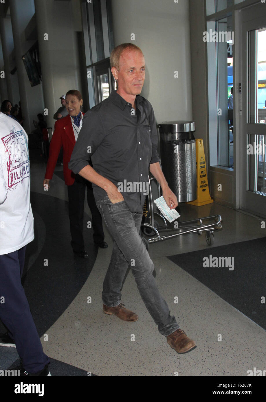 Rene Russo departs from Los Angeles International Airport (LAX) with her husband Dan Gilroy  Featuring: Dan Gilroy Where: Los Angeles, California, United States When: 02 Oct 2015 Stock Photo