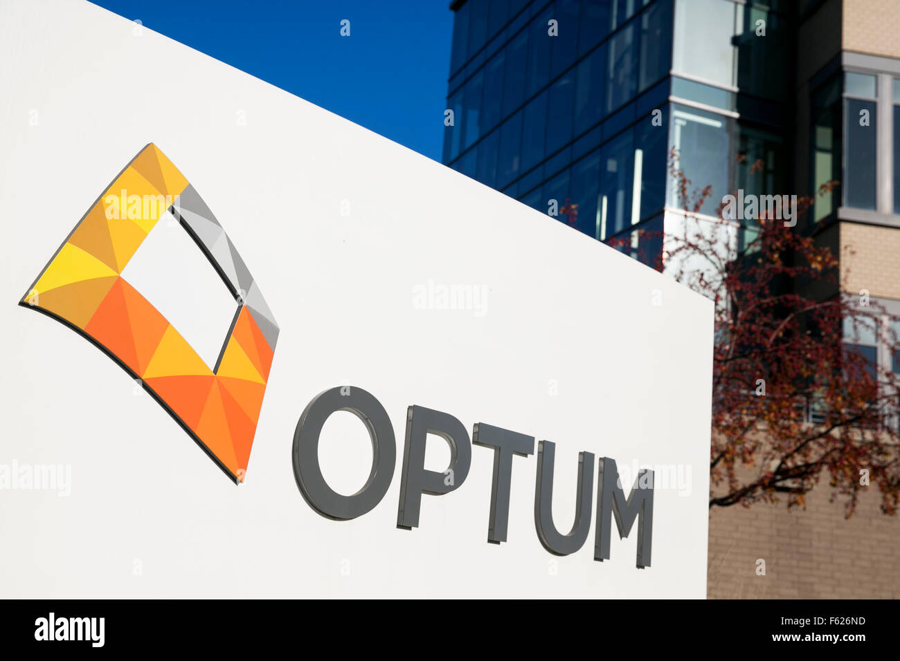 A logo sign outside of the headquarters of Optum in Eden Prairie
