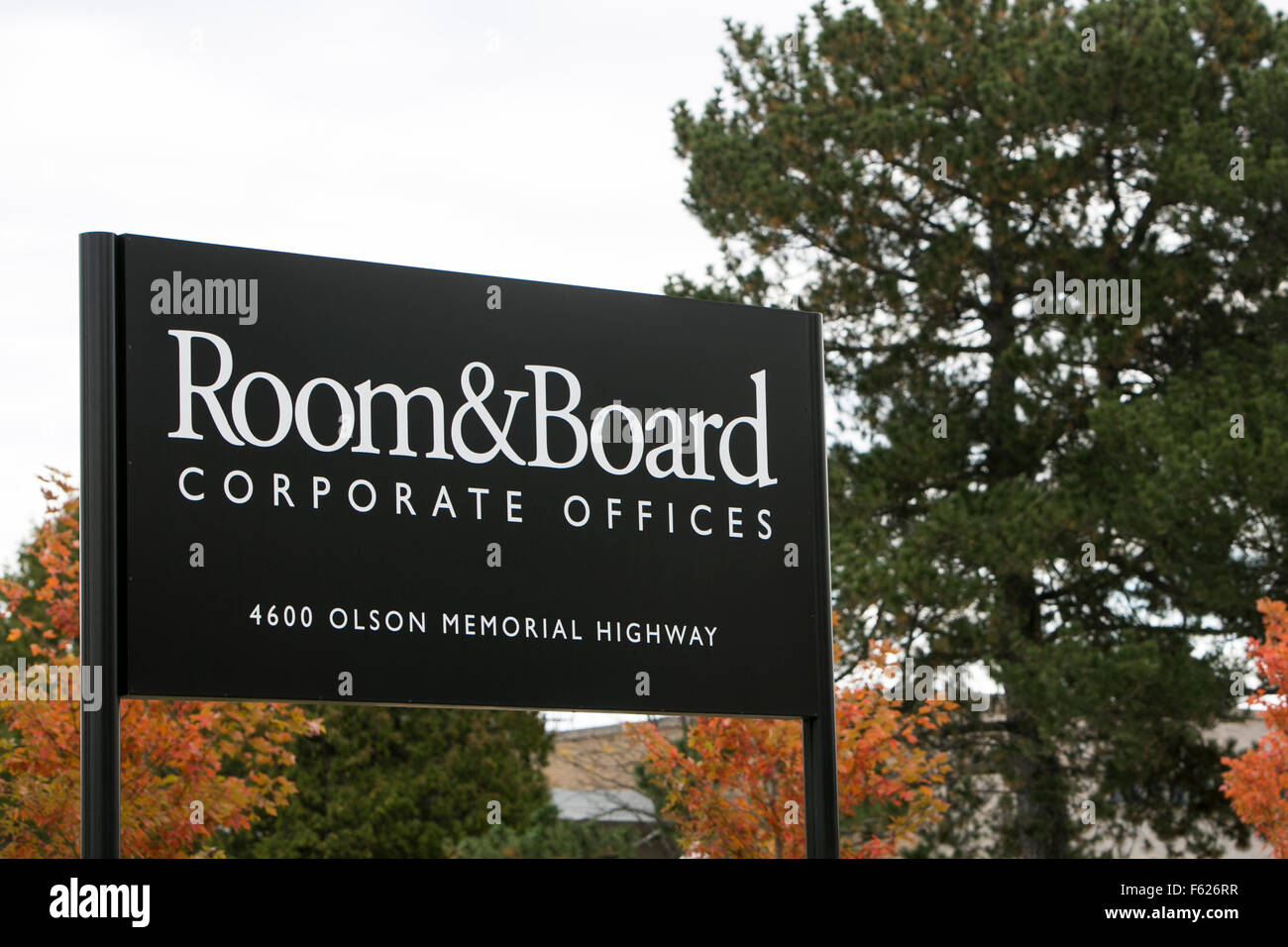 A logo sign outside of the headquarters of Room & Board in Minneapolis
