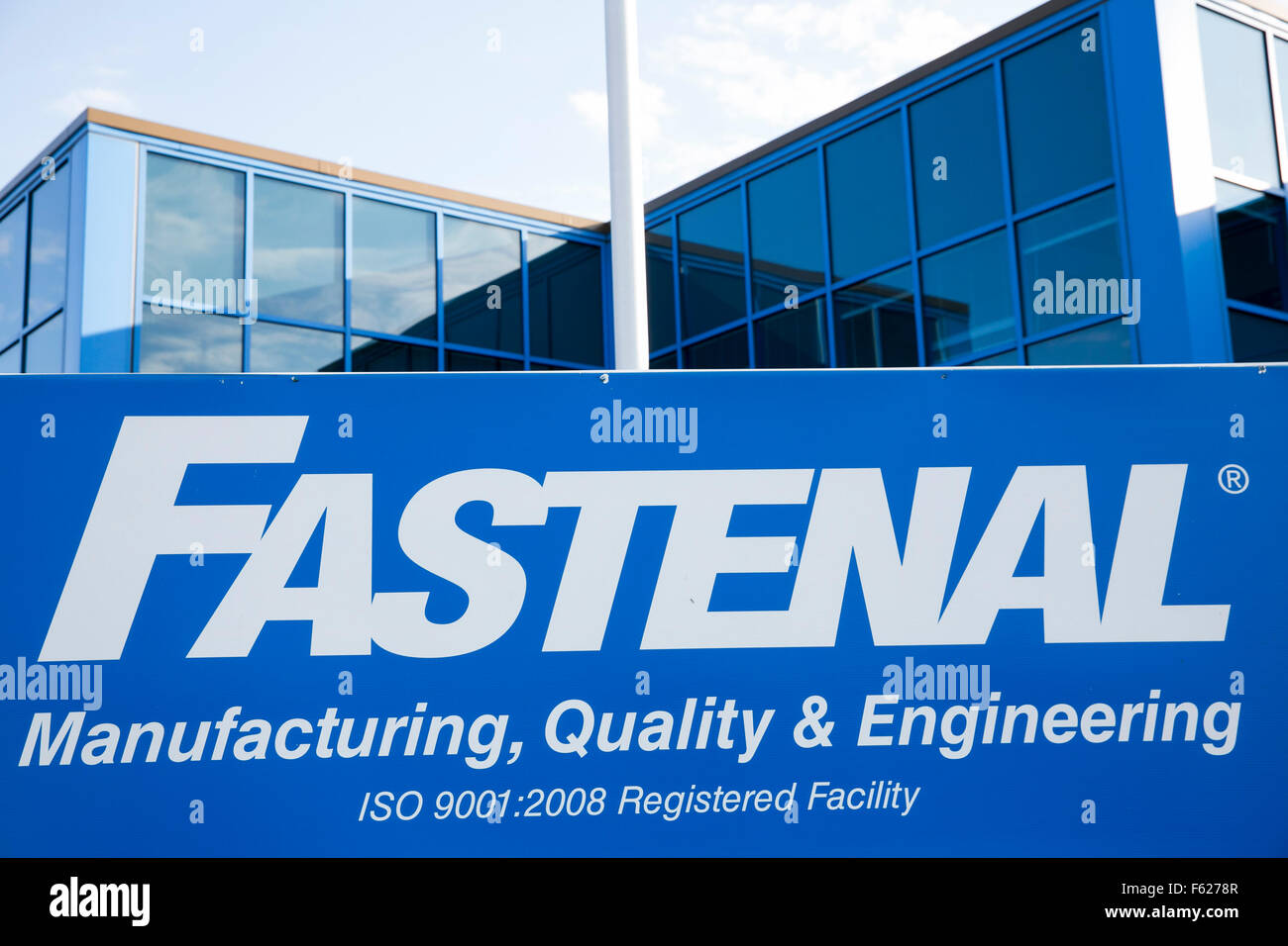 A logo sign outside of the headquarters of the Fastenal Company in