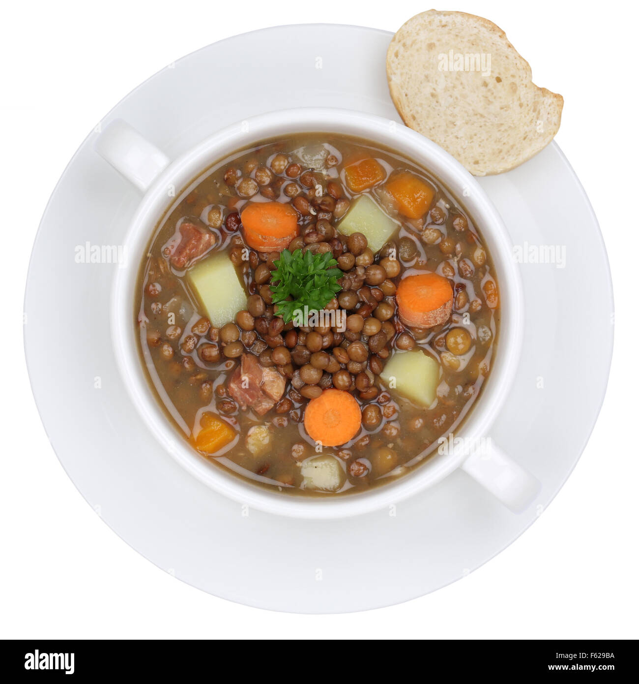Lentil soup stew meal with lentils in bowl from above isolated on a white background Stock Photo