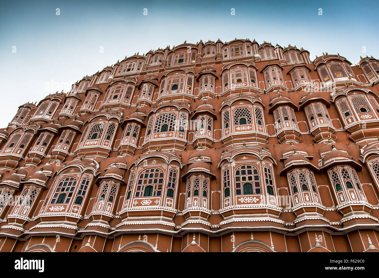 March 16, 2014 - Jaipur, Rajasthan 302001, India - This is a small collection of the many colourful people''‹ and different faces, places''‹, spaces of India. Front of the Hawa Mahal, or ''Palace of the Winds'', Jaipur. Hawa Mahal (Hindi: English translation: ''Palace of Winds'' or ''Palace of the Breeze''), is a palace in Jaipur, India, so named because it was essentially a high screen wall built so the women of the royal household could observe street festivities while unseen from the outside. Constructed of red and pink sandstone, the palace sits on the edge of the City Palace, and extends Stock Photo