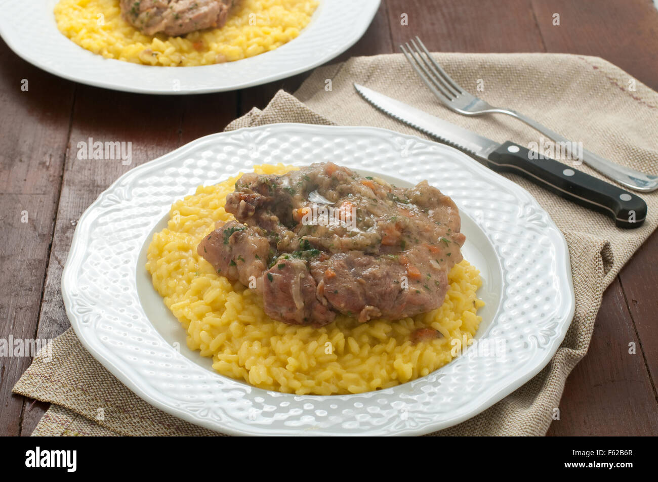 marrowbone, veal cut used in Italian cooking with yellow risotto alla milanese with safran Stock