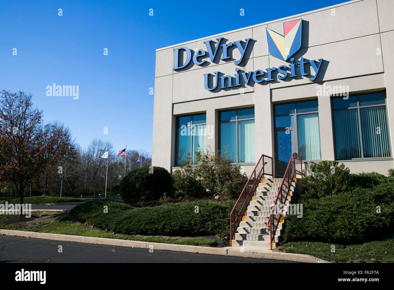 A logo sign outside of a facility occupied by DeVry University in Fort Washington, Pennsylvania on November 8, 2015. Stock Photo