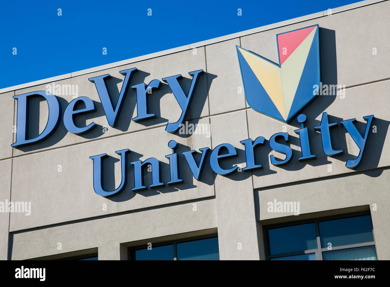A logo sign outside of a facility occupied by DeVry University in Fort Washington, Pennsylvania on November 8, 2015. Stock Photo