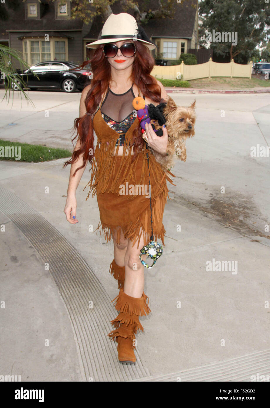 Phoebe Price wears a Pocahontas-like outfit while walking her dog Henry  Featuring: Phoebe Price Where: Los Angeles, California, United States When: 05 Oct 2015 Stock Photo