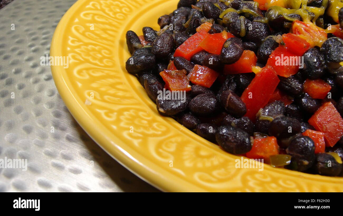 Traditional Black Beans with tomatoes and cheese Stock Photo Alamy