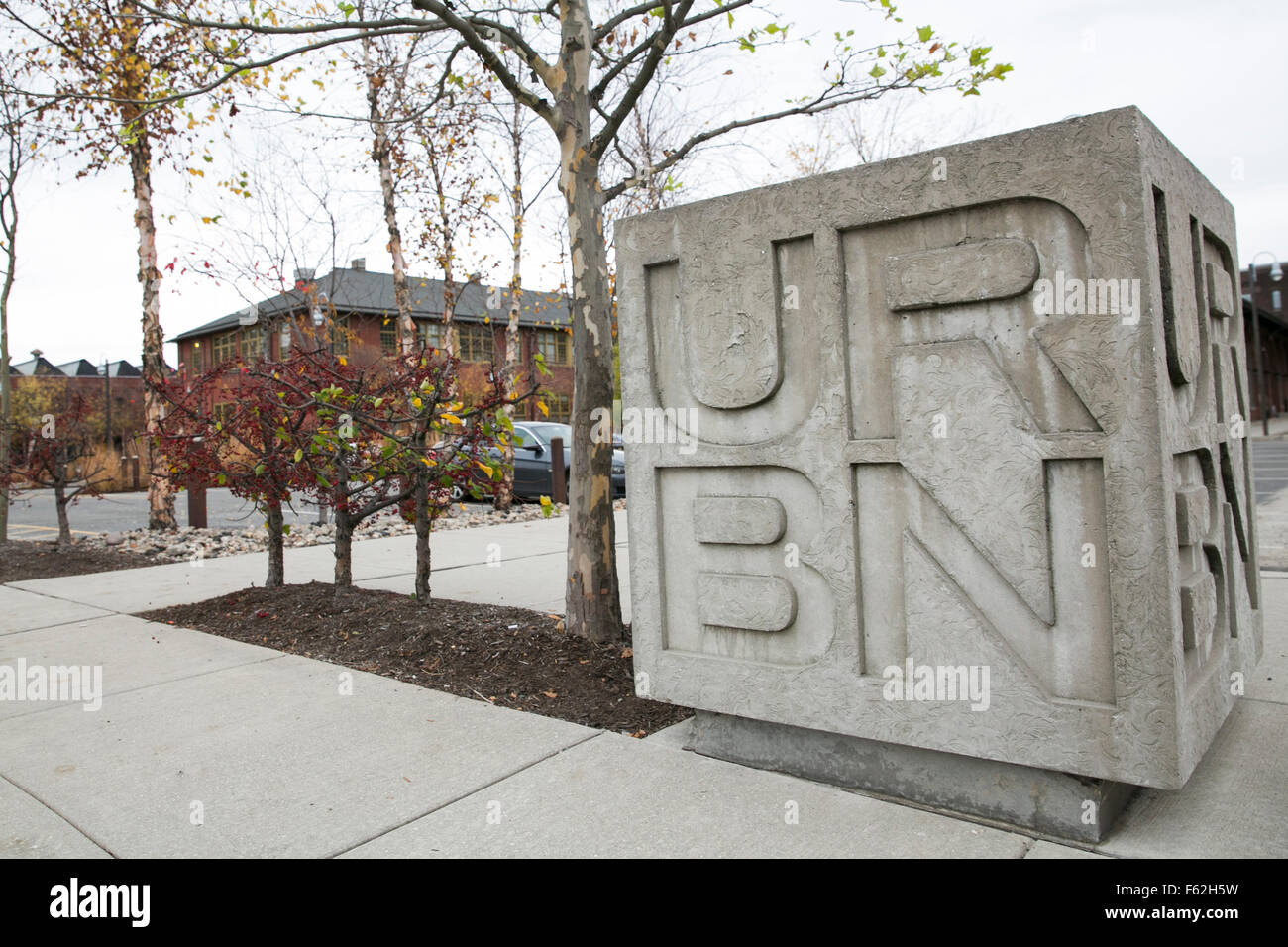 A logo sign outside of the headquarters of Urban Outfitters, Inc., in