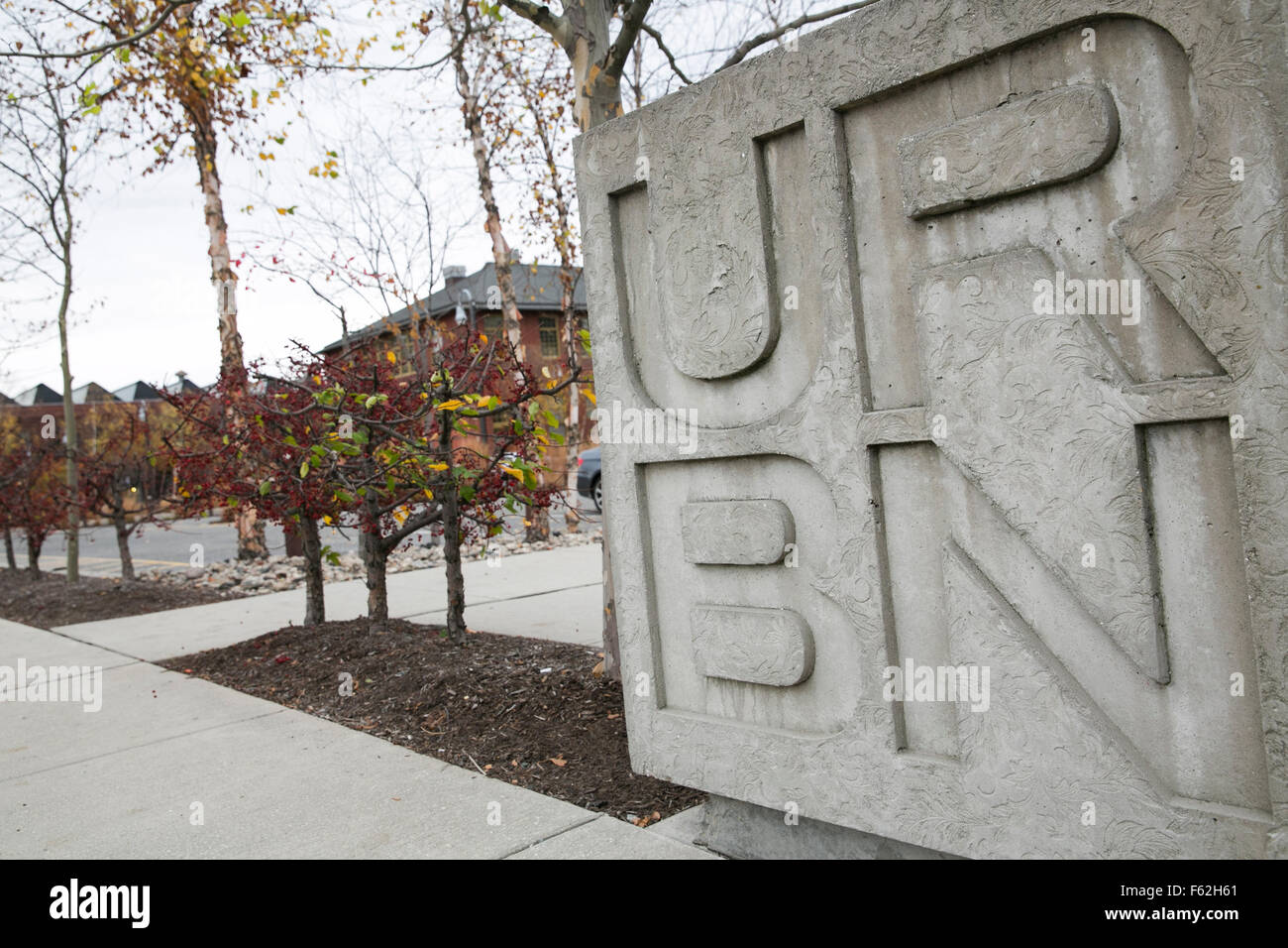 A logo sign outside of the headquarters of Urban Outfitters, Inc., in