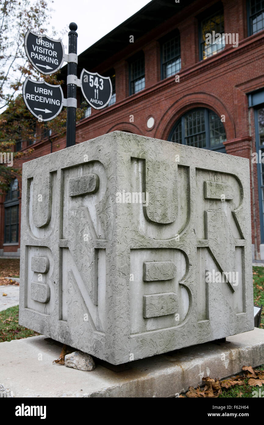 A logo sign outside of the headquarters of Urban Outfitters, Inc., in