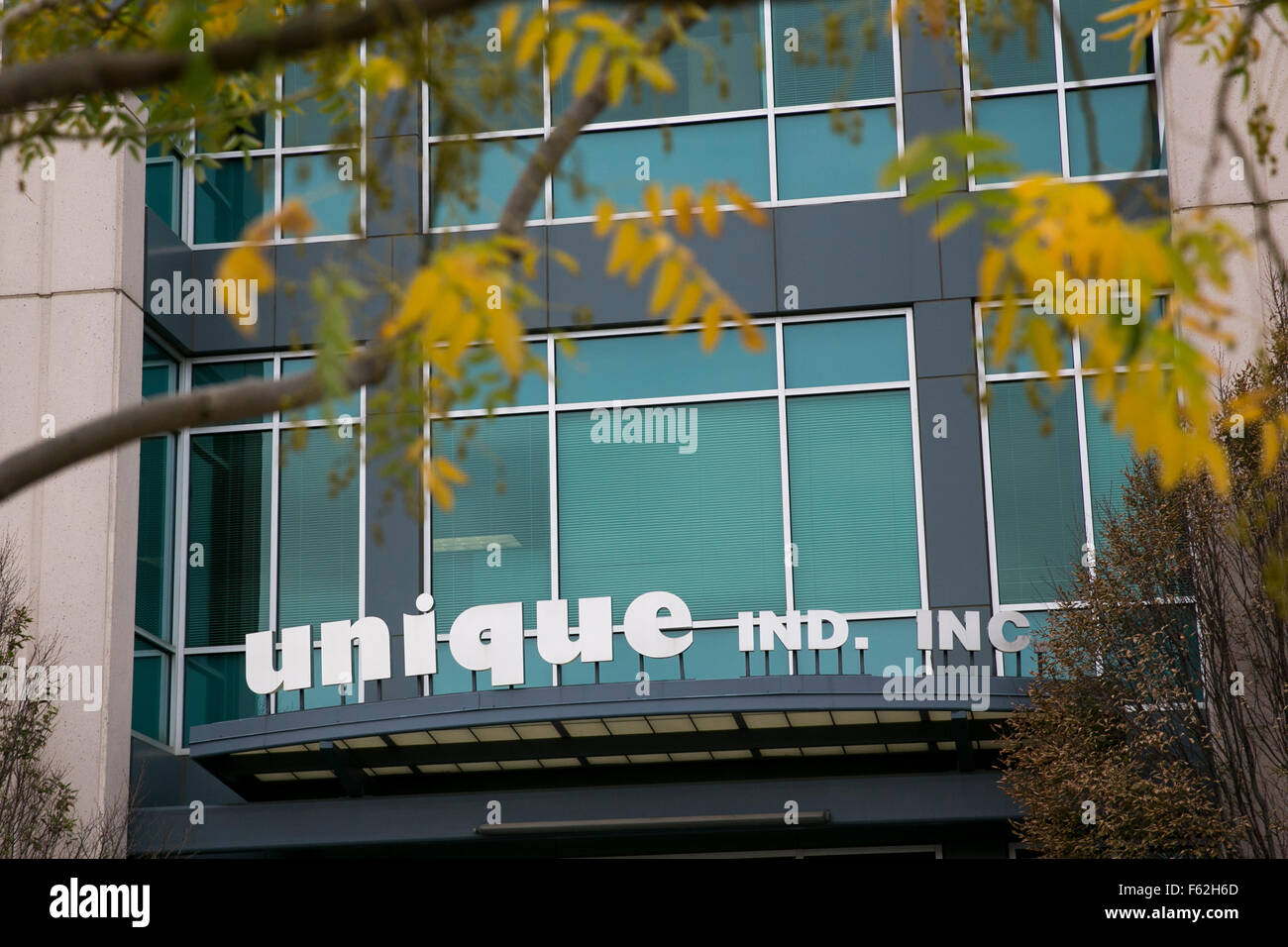 A logo sign outside of the headquarters of Unique Industries, Inc., in Philadelphia, Pennsylvania on November 7, 2015. Stock Photo