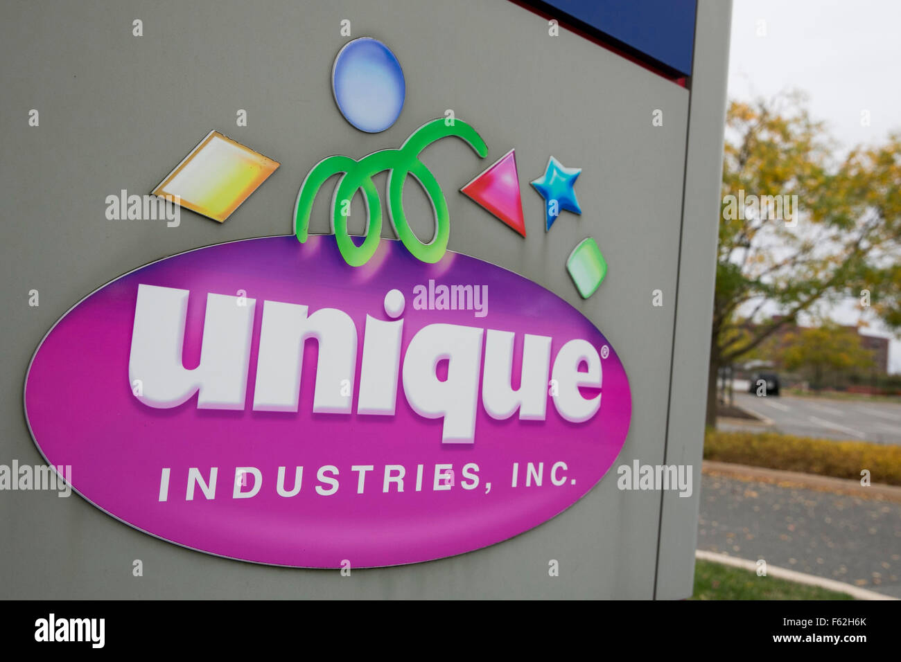 A logo sign outside of the headquarters of Unique Industries, Inc., in Philadelphia, Pennsylvania on November 7, 2015. Stock Photo