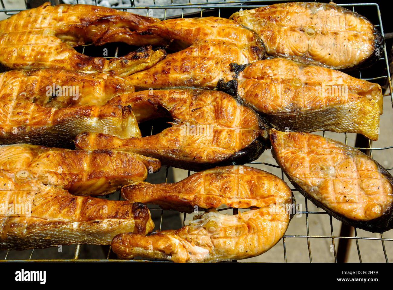 Grilled red fish steak salmon on the grill pan Stock Photo