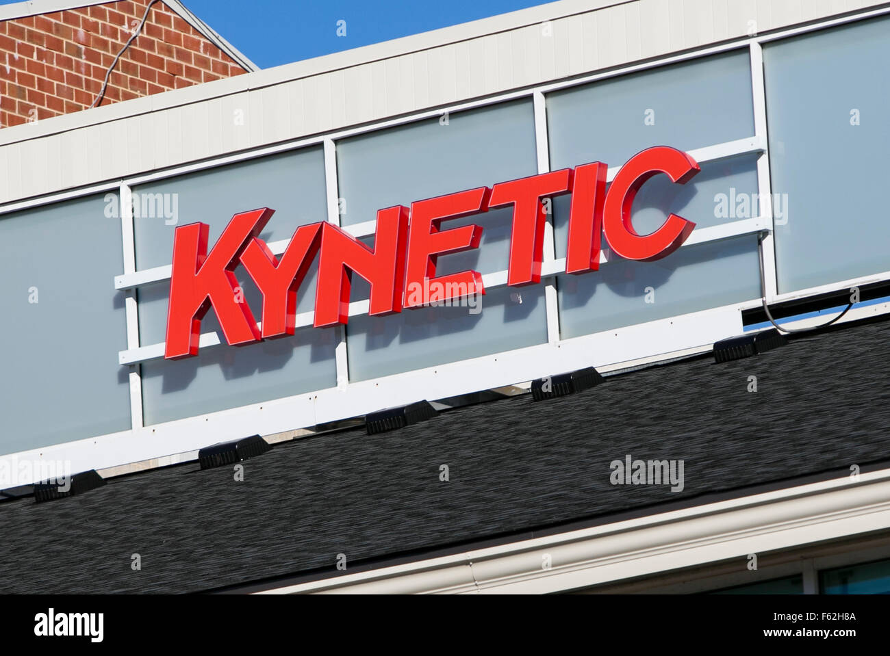 A logo sign outside of the headquarters of the parent company